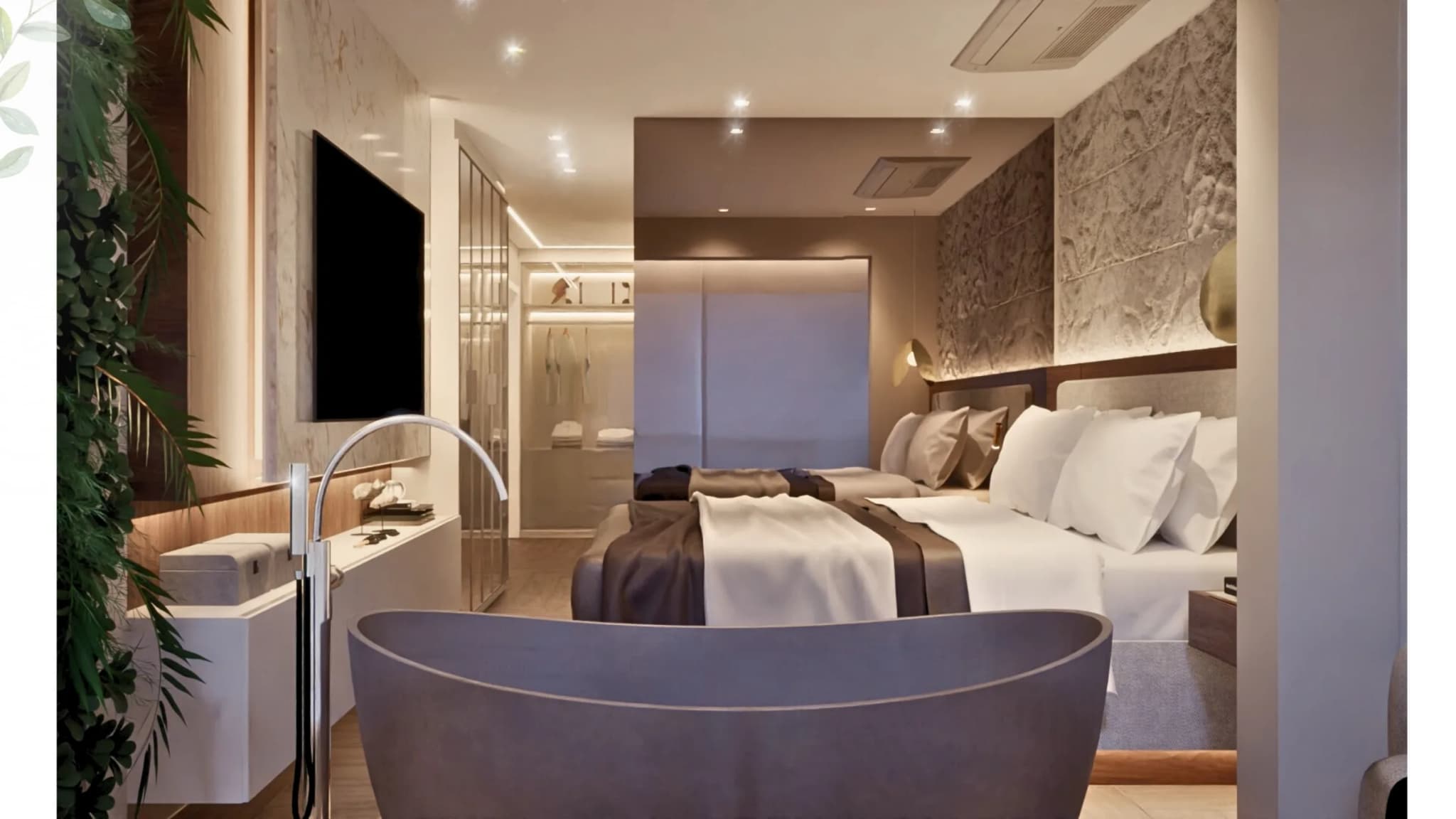 Suíte com banheira junto à cama, painel de TV em pedra clara e iluminação embutida na marcenaria